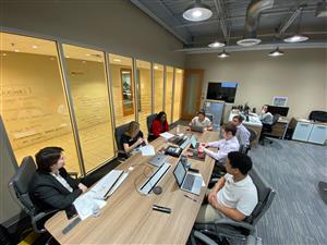Interns presenting to a company